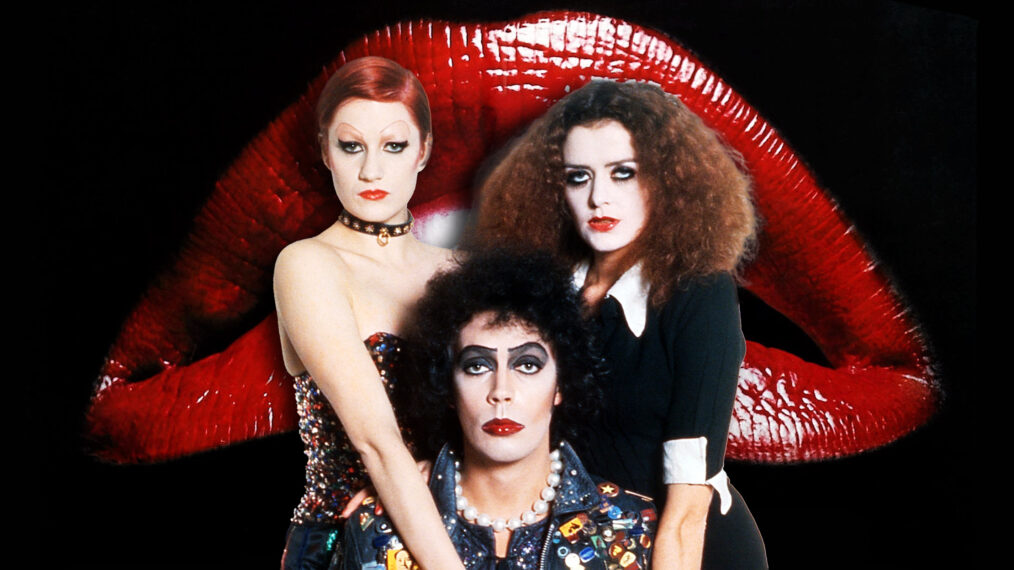 drie zwaar opgemaakte karakters uit de de Rocky Horror voor een grote rode mond
